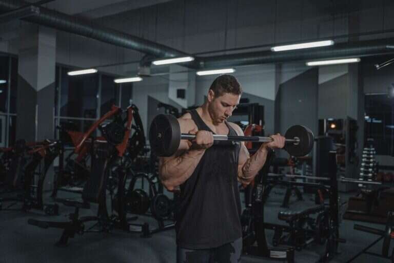 Person lifting a barbell during a strength training session