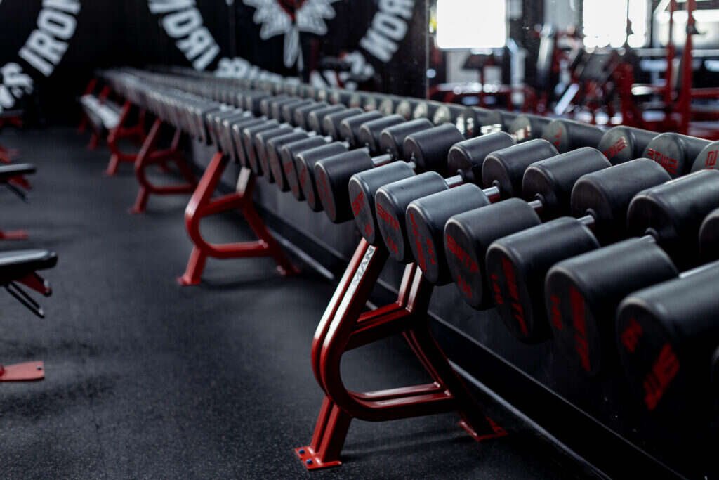 Full dumbbell rack running the length of the Gryffon Performance training floor