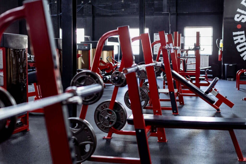 Plate-loaded strength equipment at a private Dallas personal training studio