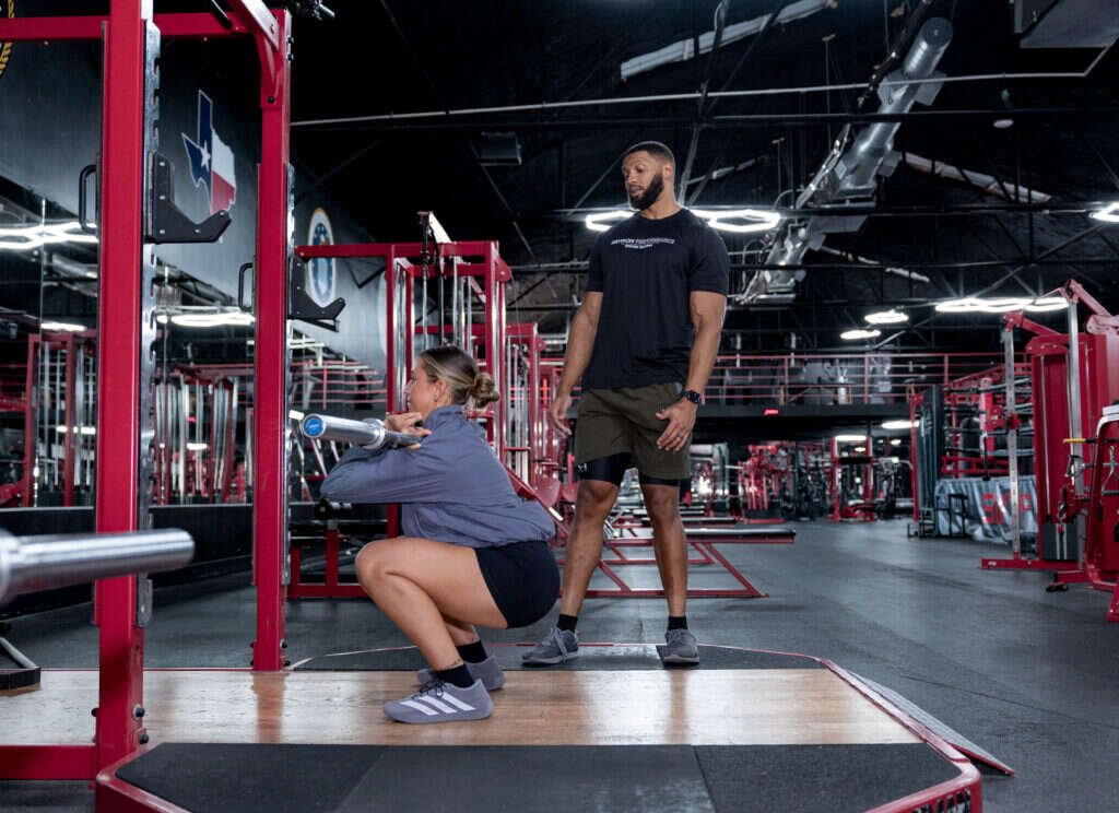 Landmine squat coached by a personal trainer at Gryffon Performance in Dallas